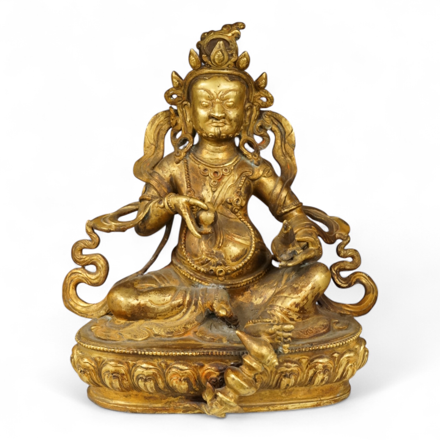 A large Sino-Tibetan gilt-bronze seated figure of Jambhala, 28cm high